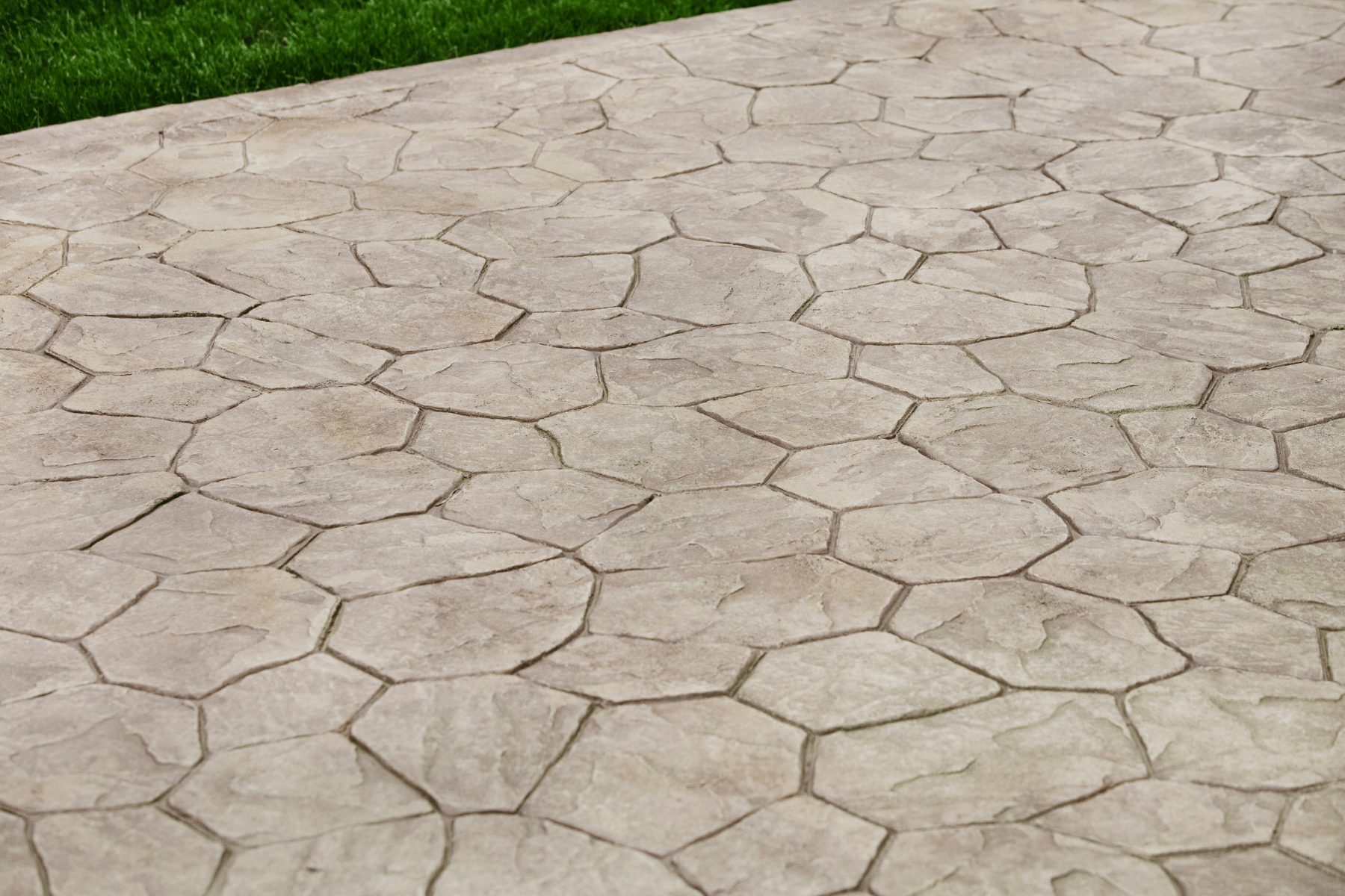 Exposed Aggregate Reveal the natural beauty of aggregate stone for a textured, slip-resistant surface with distinctive appearance.